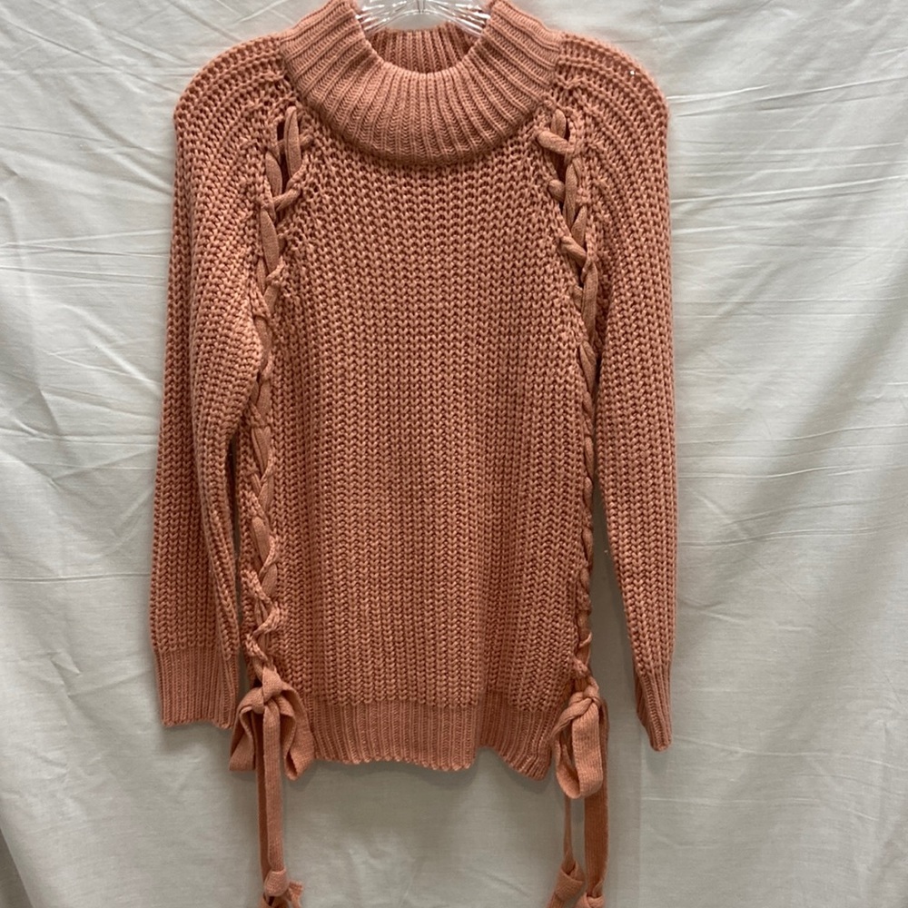 Coral sweater with braided side ties